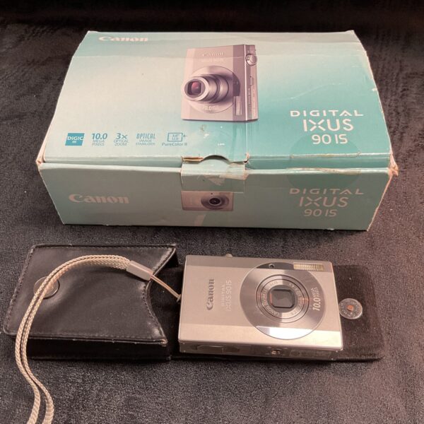 Canon IXUS 90 IS digital camera in original box with charger.