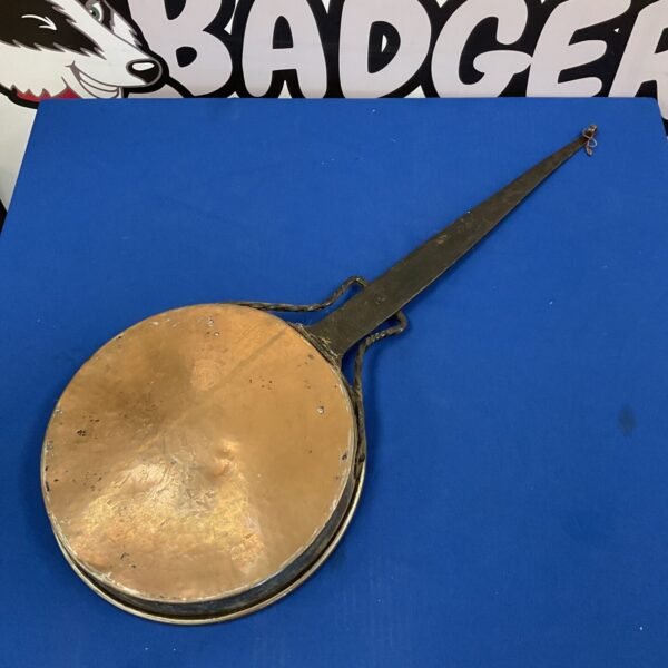 Antique copper cooking pan with iron handle, vintage kitchenalia.