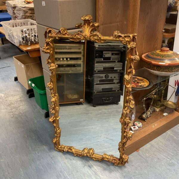 Ornate gilt framed French mirror, antique wall décor.