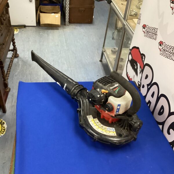 Vintage Homelite petrol leaf blower for garden use.