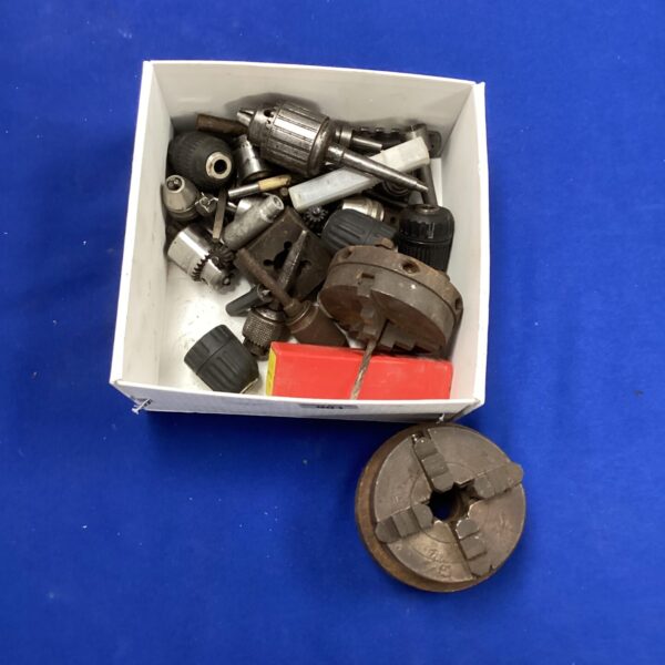 Assortment of vintage metal drill chucks for metalworking.