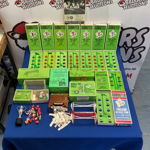 Vintage Subbuteo collection with teams, goals, and score recorder.