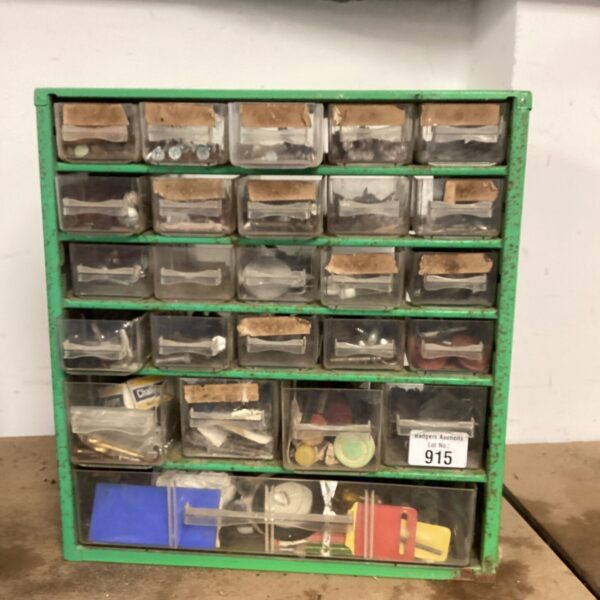 Green metal garage storage unit with plastic drawers.