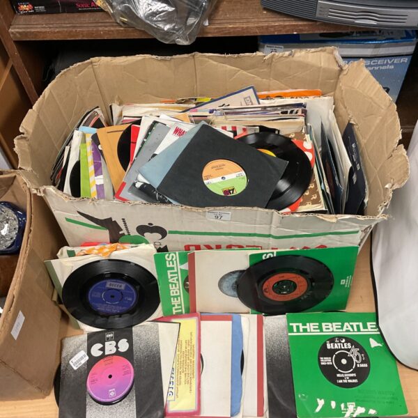 Large lot of vintage 7-inch vinyl records including Beatles singles.