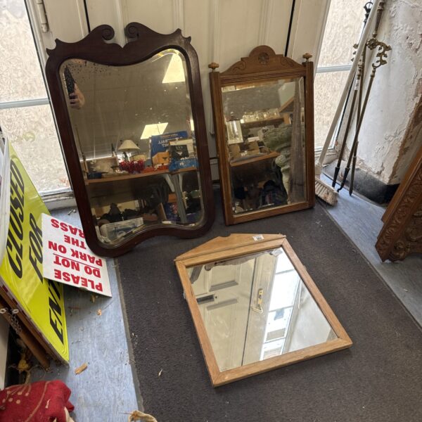 Gilded vintage dressing table mirror with ornate detailing.