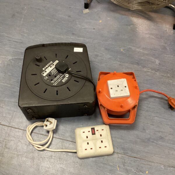 Close-up of a multi-socket electric extension lead in used condition.