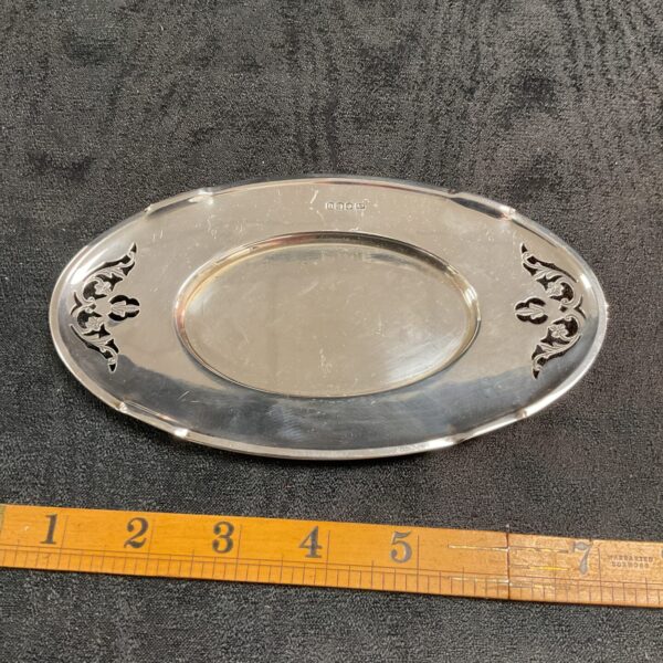 Antique silver Art Nouveau dish with embossed detailing.