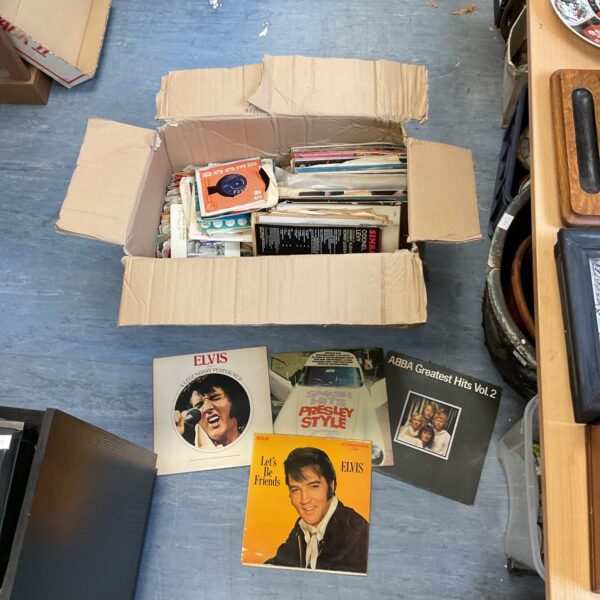 Assorted vinyl record collection featuring Elvis Presley and ABBA.
