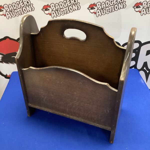 Vintage mahogany magazine rack for storing magazines and periodicals.