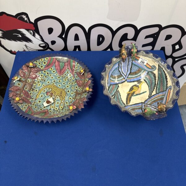 Vibrant Ardmore pottery serving bowls with detailed animal designs.