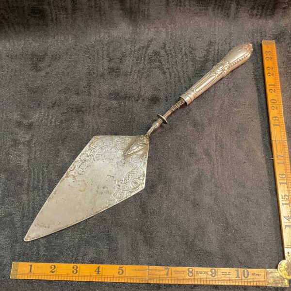 Antique Victorian silver pie server with hallmarked blade.