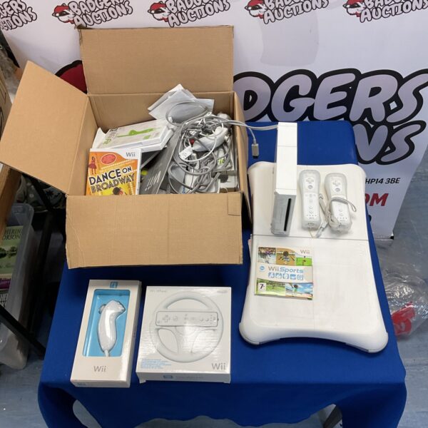 Nintendo wii console with two remotes, in box nunchucks, wii fit board and assorted games