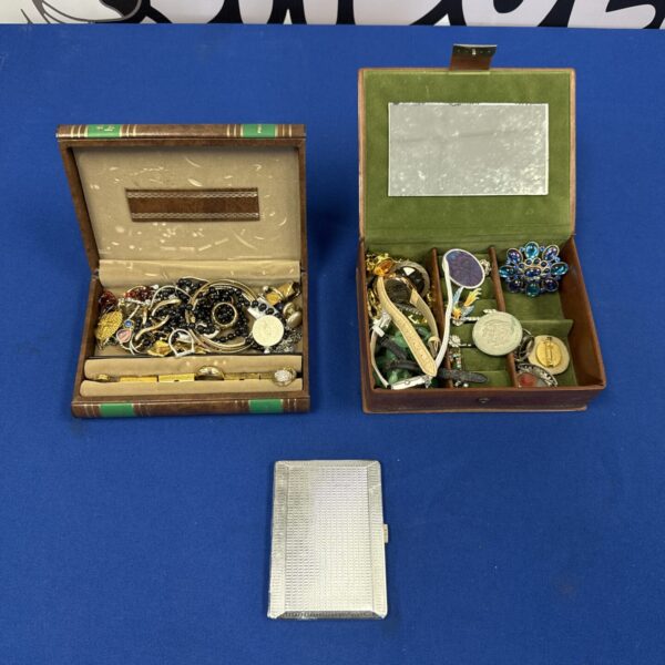 Vintage jewellery boxes with velvet lining and costume jewellery contents.