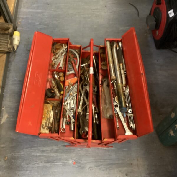Vintage metal cantilever tool box filled with various tools for DIY projects.