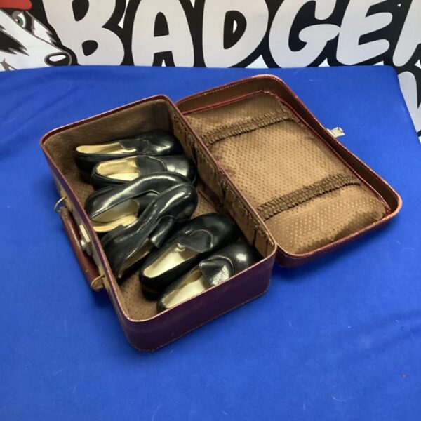 Vintage leather carry case with three pairs of kids tap dancing shoes