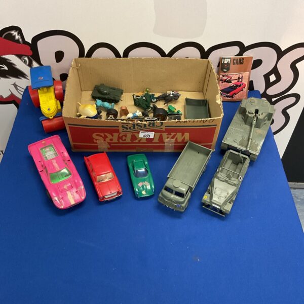Vintage toy vehicles and figures in a colourful lot.