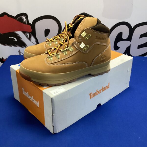 Tan leather Timberland boots size 6.5, classic outdoor footwear.
