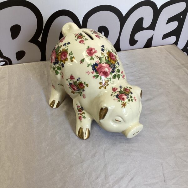 Vintage Staffordshire pottery pig money box with floral decoration.