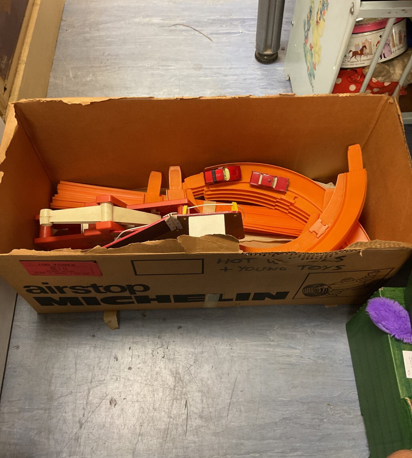 Box containing vintage matchbox track set with diecasts