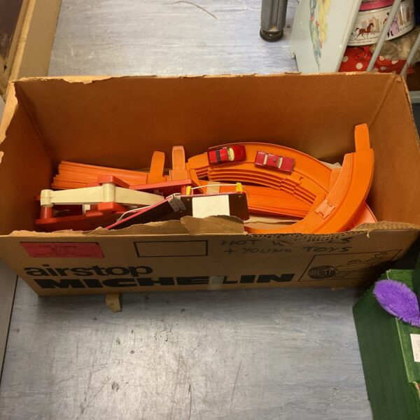 Box containing vintage matchbox track set with diecasts