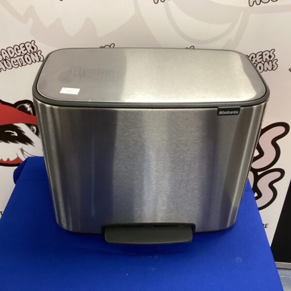 Stainless steel Brabantia recycling bin for kitchen waste separation.