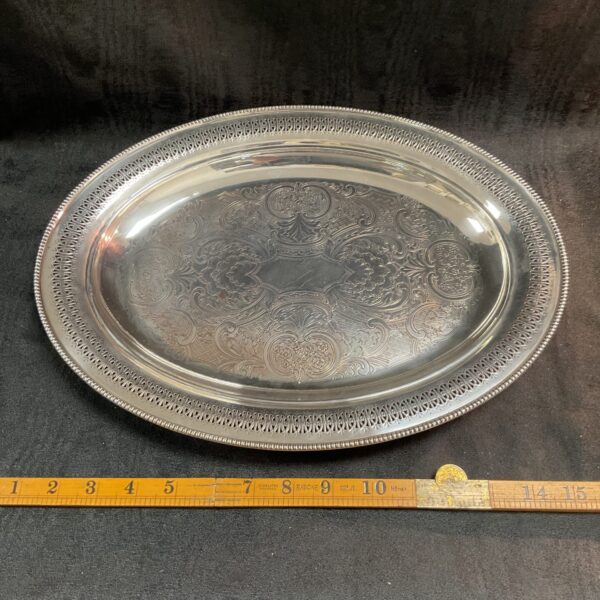 Antique Mappin and Webb silverplate serving plate with embossed design.