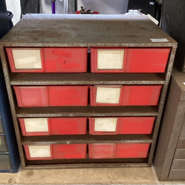Vintage metal drawer unit with plastic drawers for workshop storage.