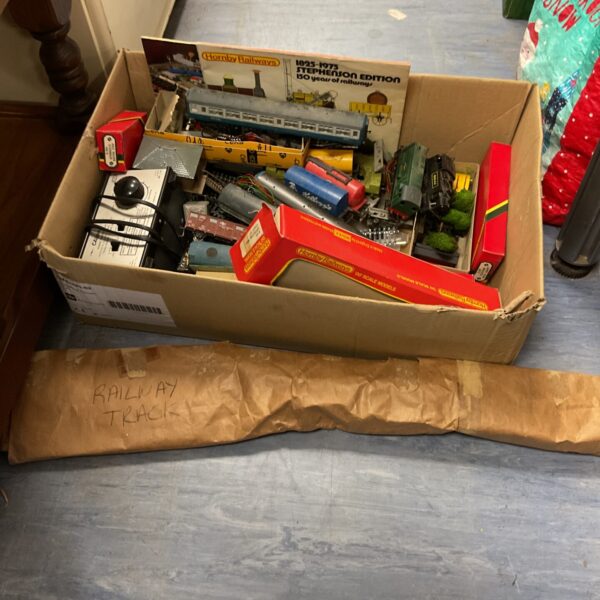 Vintage Hornby Railways collection in a cardboard box.
