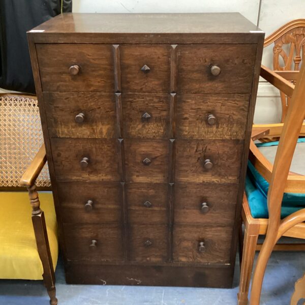 Dark wood mid century gothic style chest of drawers