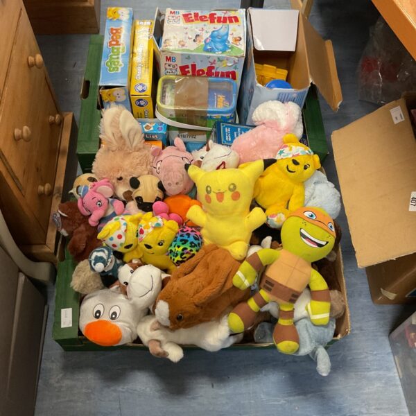 Two crates of mixed soft toys and games inc pugsy bear and pikachu