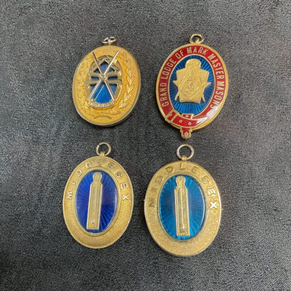 Vintage Masonic collar jewels lot, featuring silver and enamel details.