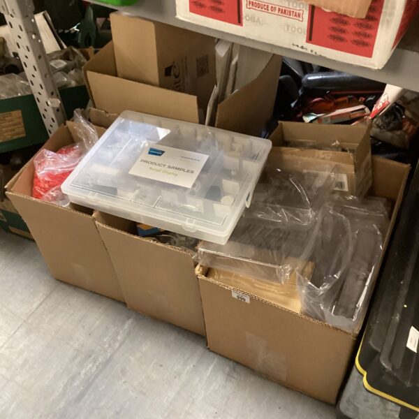Clear plastic display cases and organizers in a storage lot.