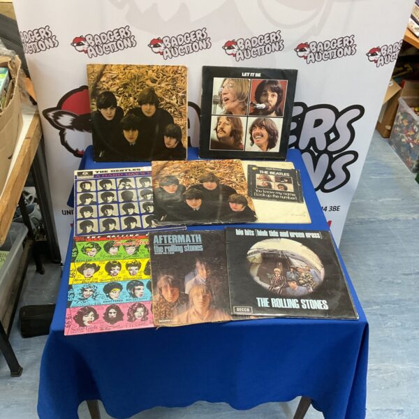 Vintage Beatles and Rolling Stones vinyl records for collectors.