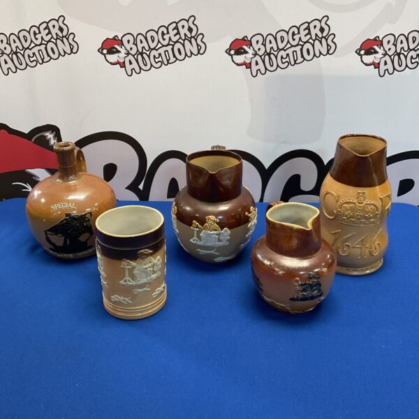 Five royal doulton lambeth ware jugs, tankard & flagon including special highland whisky