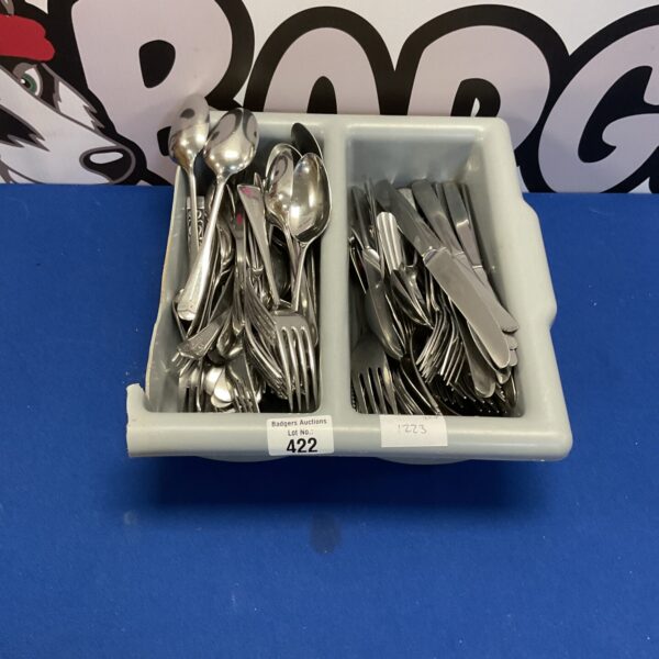 Mixed cutlery lot with vintage spoons, forks, and knives.