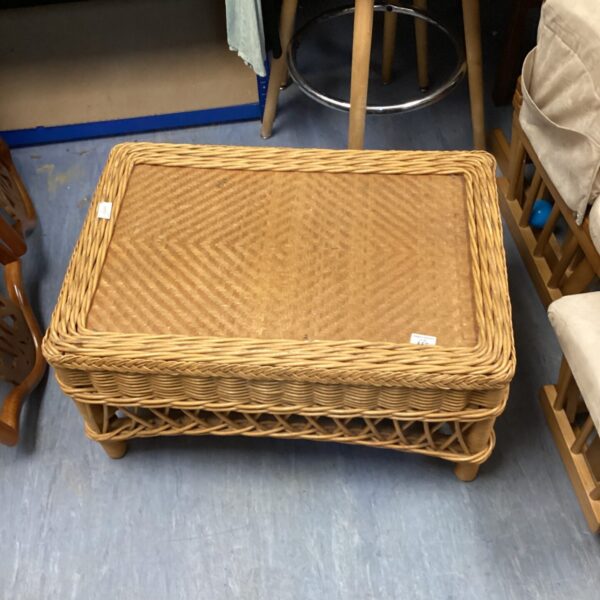 Vintage wicker coffee table with woven rattan design.