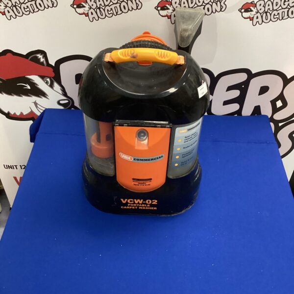 Front view of a Vax Commercial portable carpet cleaner.