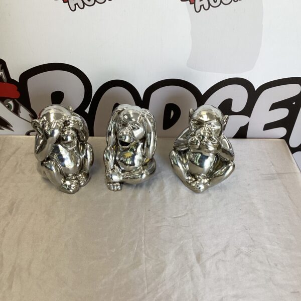 Three ceramic wise monkey money boxes, vintage collectible figurines.