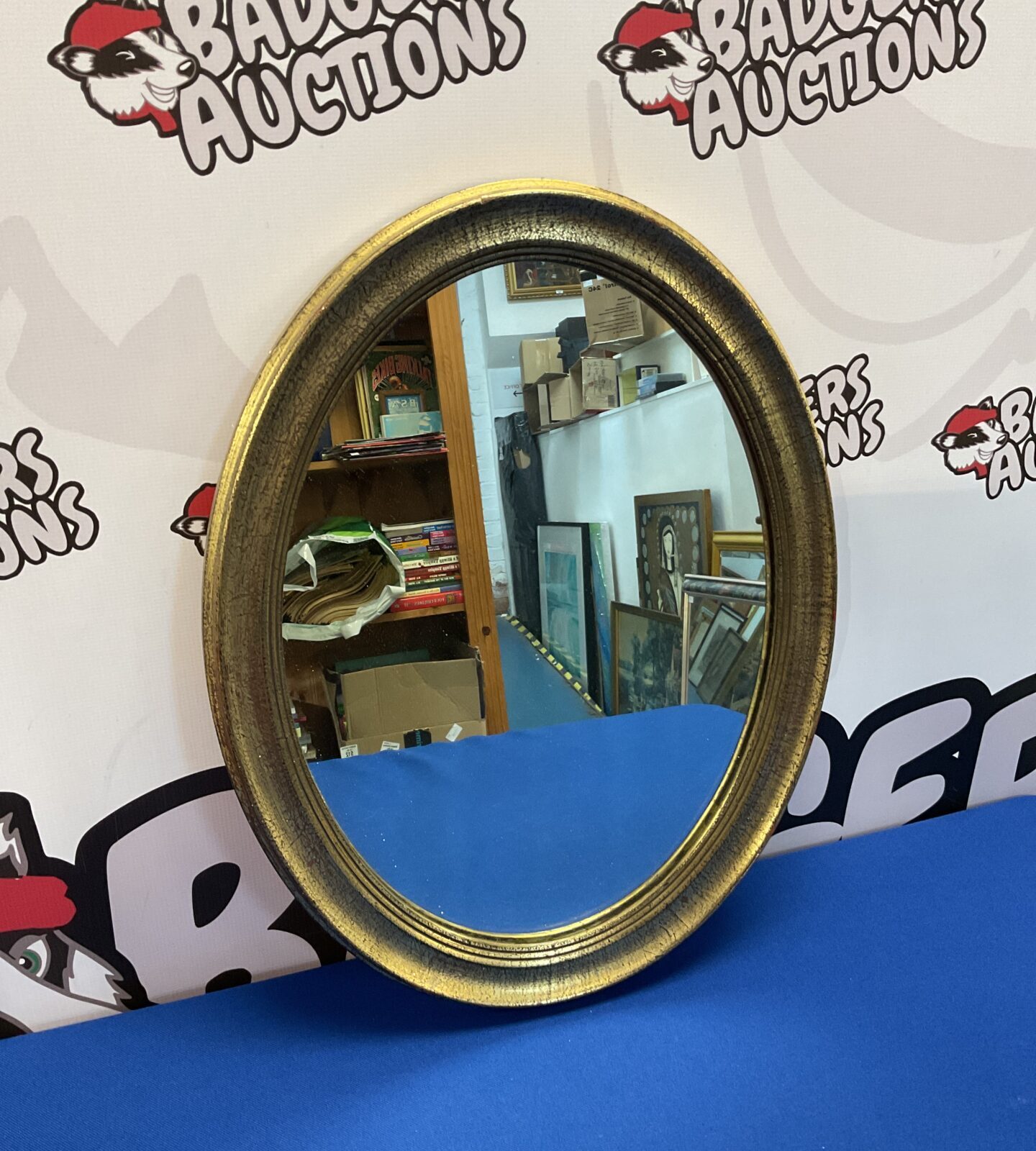Gilt framed oval mirror