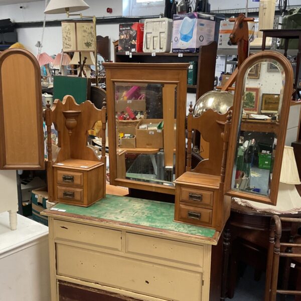 Antique mahogany dressing table with mirror and drawers.