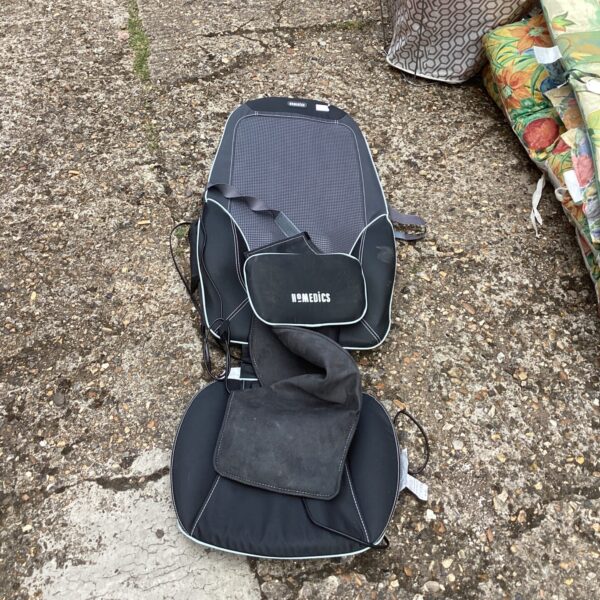 Homedics heated chair pad with elastic strap shown in detail.