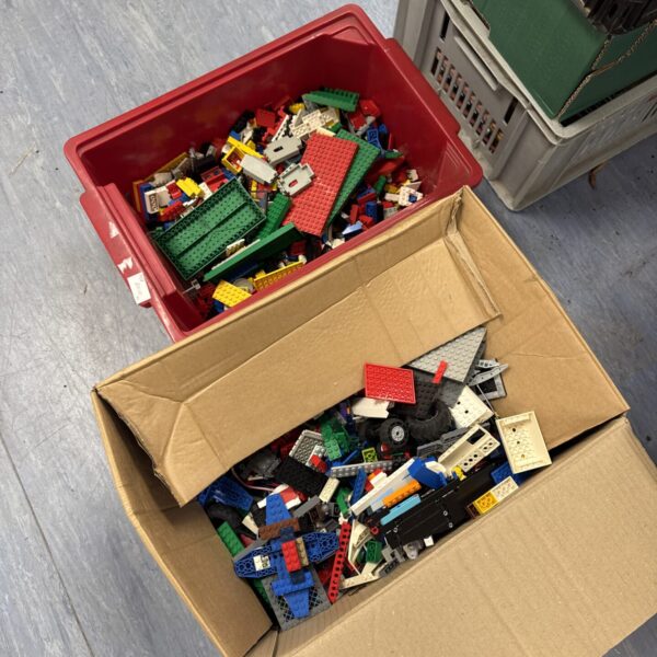 Two boxes of vintage Lego bricks for building and collecting.