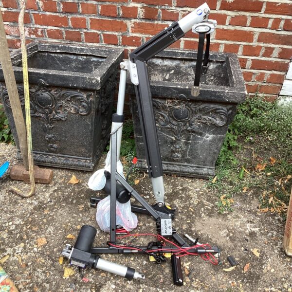 Side view of an Autochair person lift hoist in used condition.