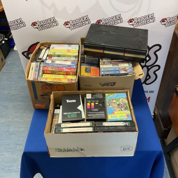 Mixed lot of vintage video cassettes and tape storage drawer.