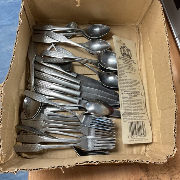 Vintage shaped cutlery set with stainless steel handles.