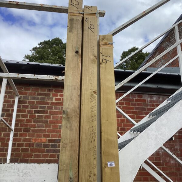 Three bundles of 10ft timber for construction projects.