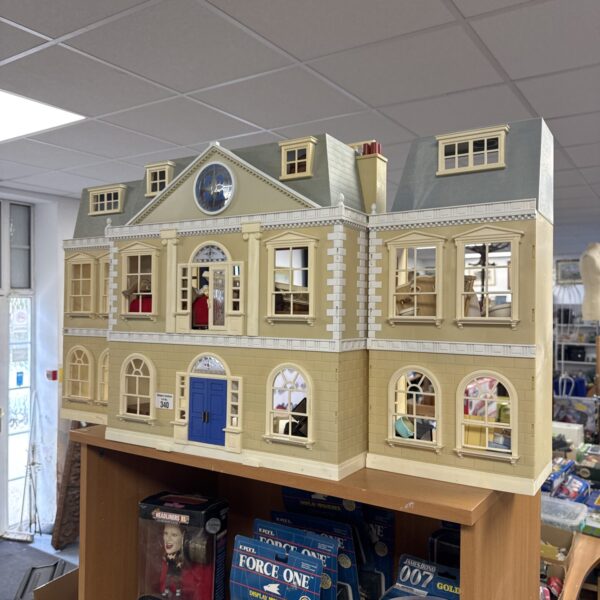 Large Sylvanian Families dolls house with detailed exterior.