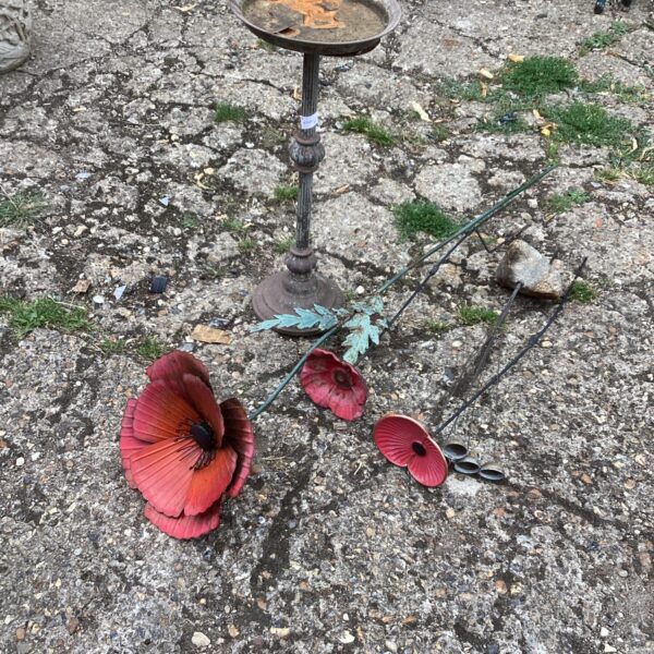 Vintage metal garden poppy bird bath for outdoor decoration.