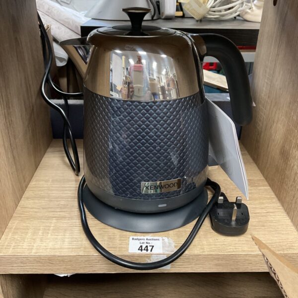 Polished stainless steel Kenwood ZJM810 electric kettle with black handle.