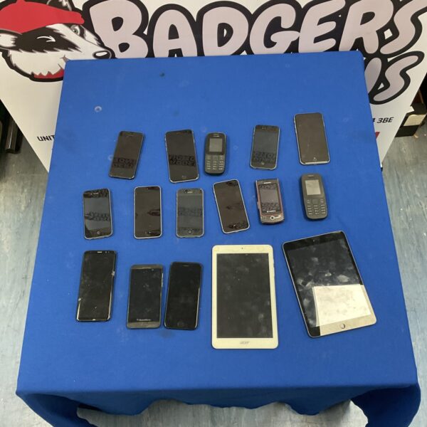 Mixed lot of used smartphones and a tablet for collectors.